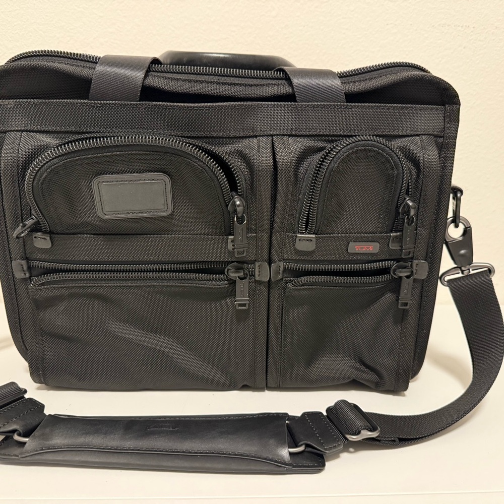 Tumi Black Briefcase with Multiple Pockets